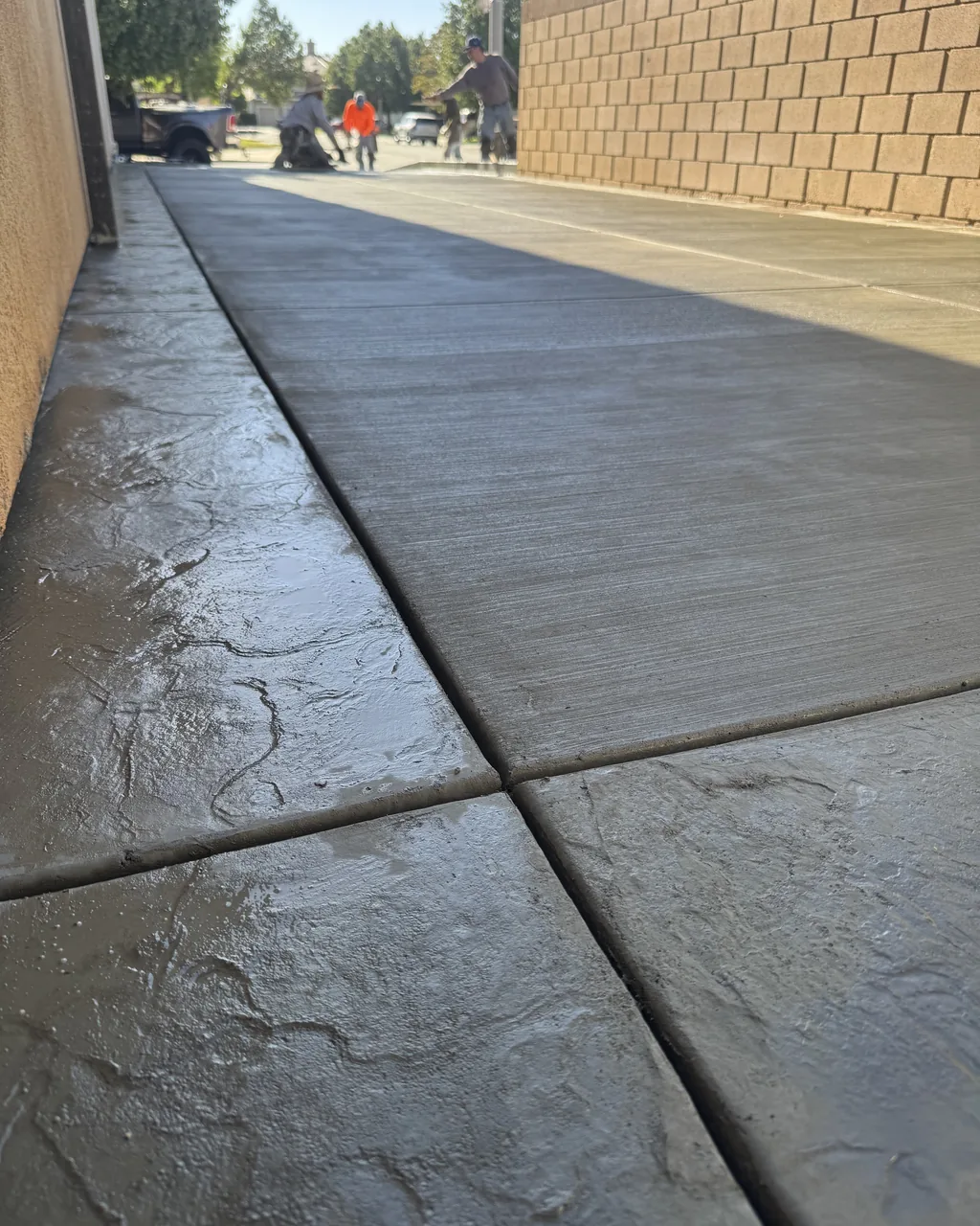 Stamped ashlar slate driveway in a two-tone colour, wet finish