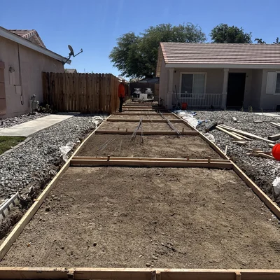 A driveway formed and reinforced with rebar, ready for the pour